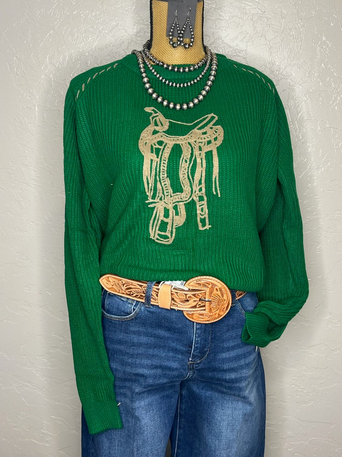Green sweater w/saddle